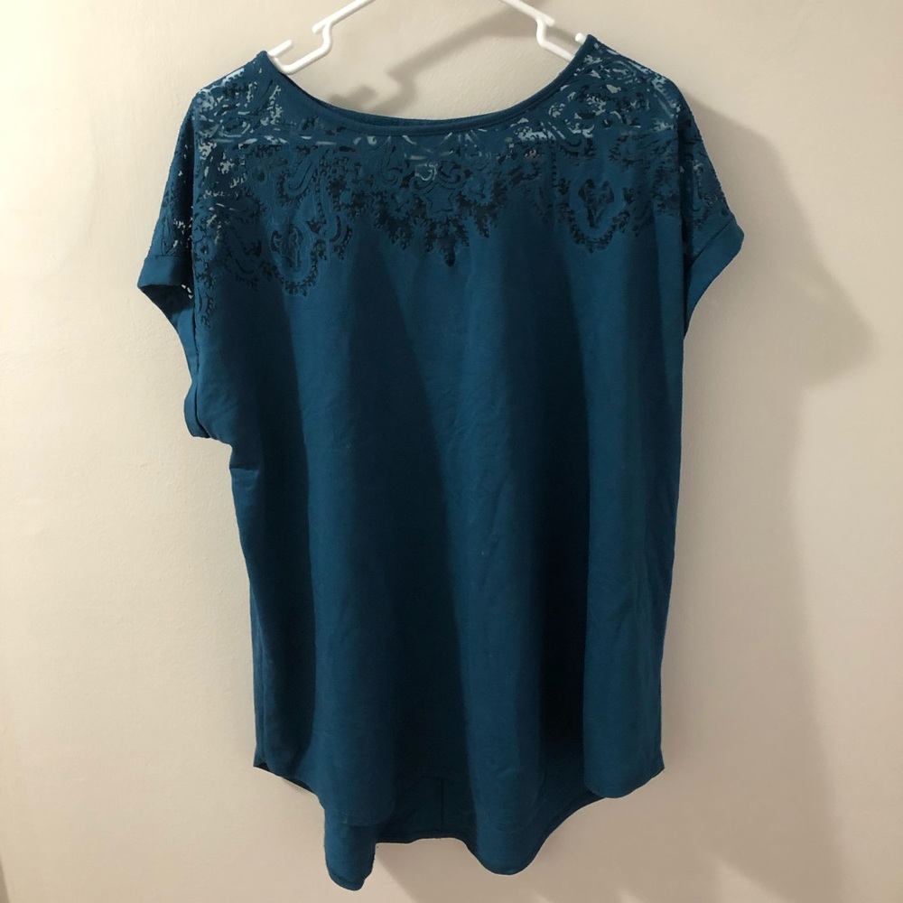 Teal top with laser floral pattern on top